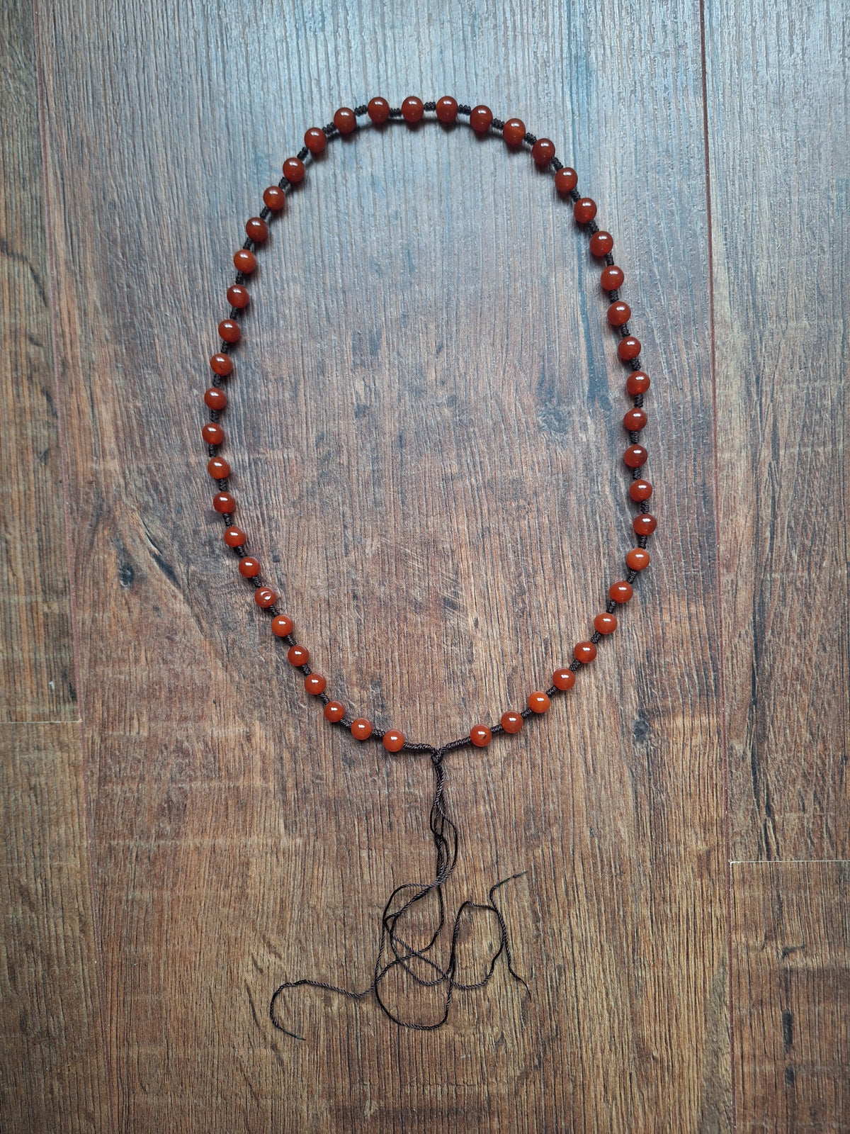 Amulet cord with carnelion beads