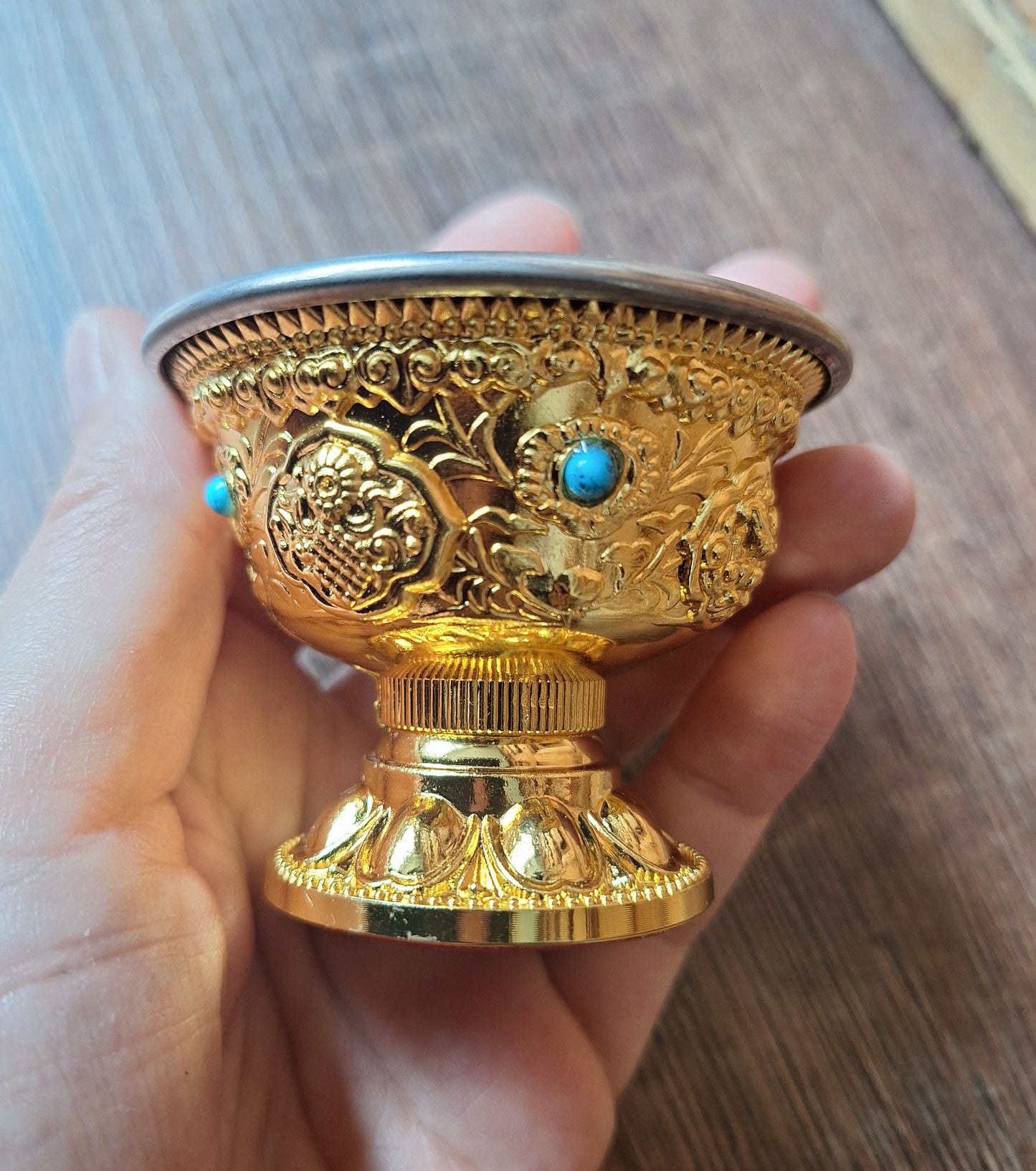 Gold coloured metal alloy offering bowl