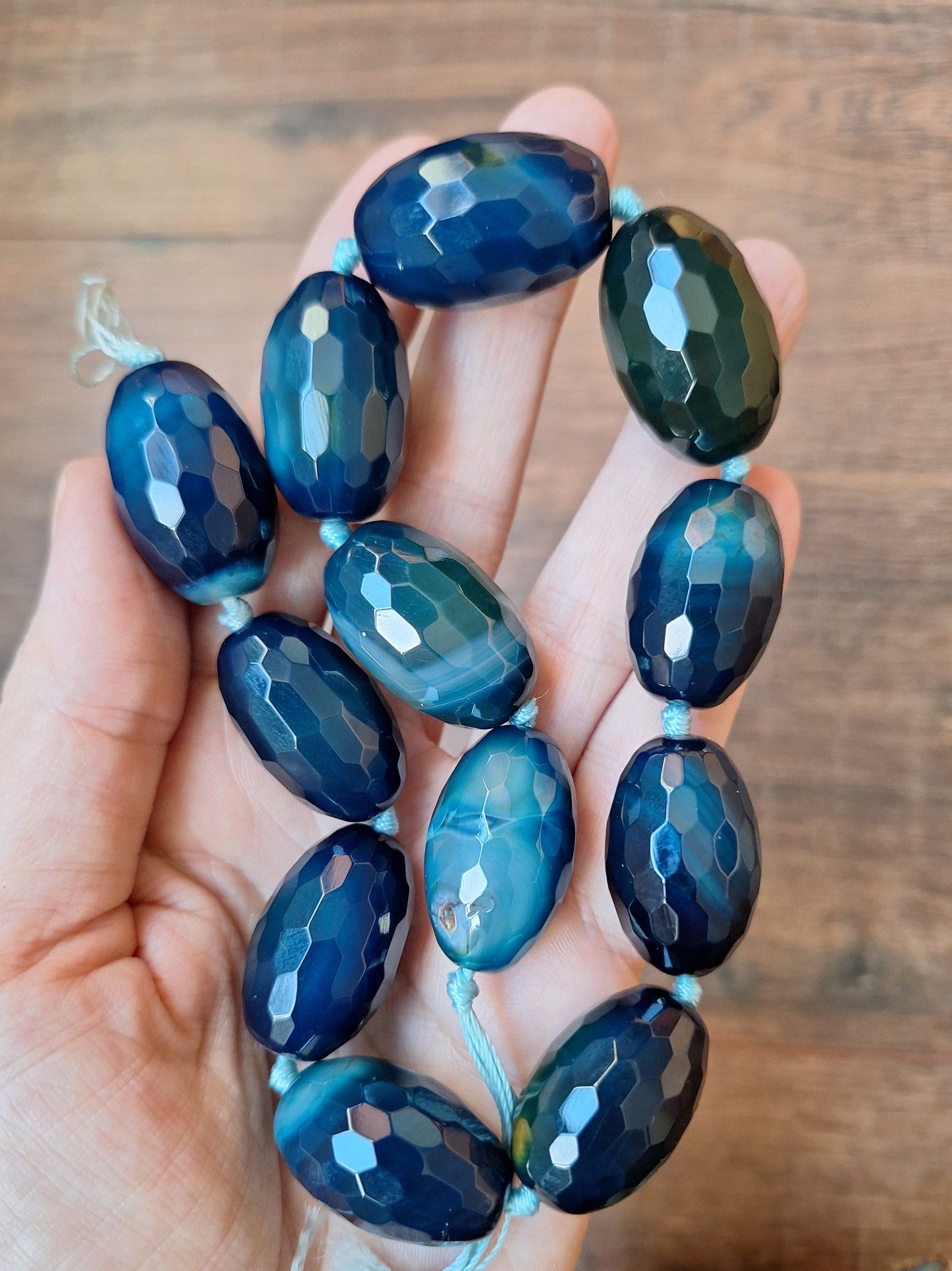 Faceted blue agate bead strand