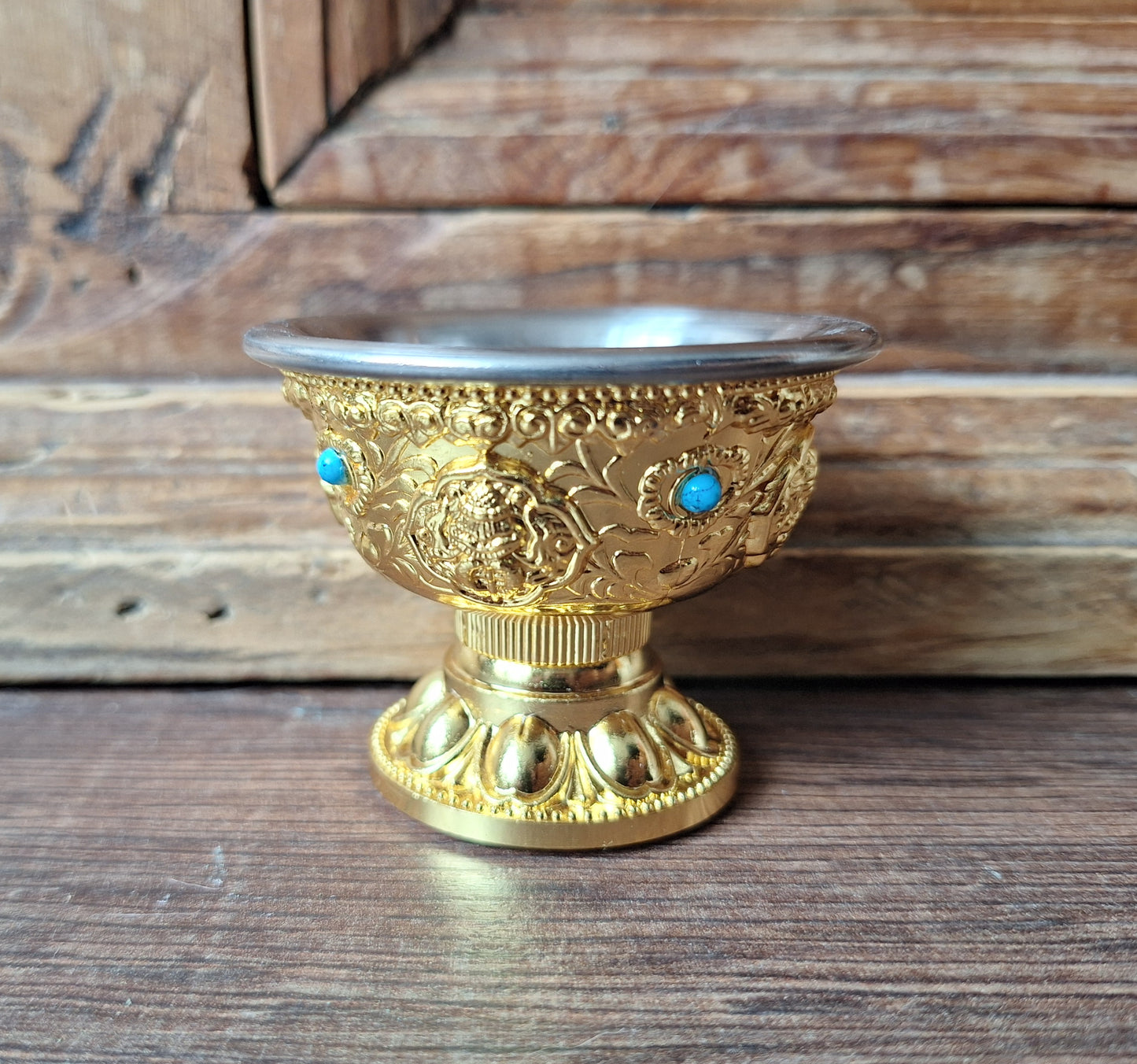 Gold coloured metal alloy offering bowl