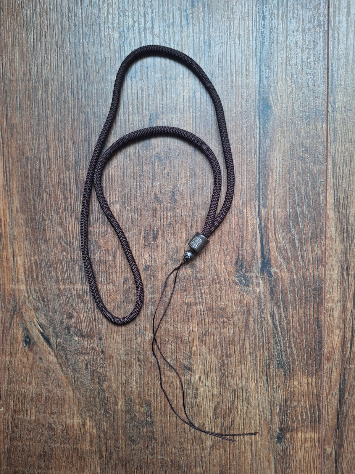 Amulet cord brown with shou symbol